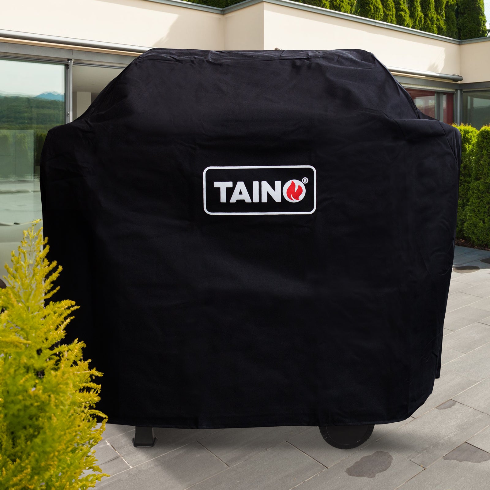 TAINO BASIC Grill abgedeckt mit Abdeckhaube auf einer Terrasse
