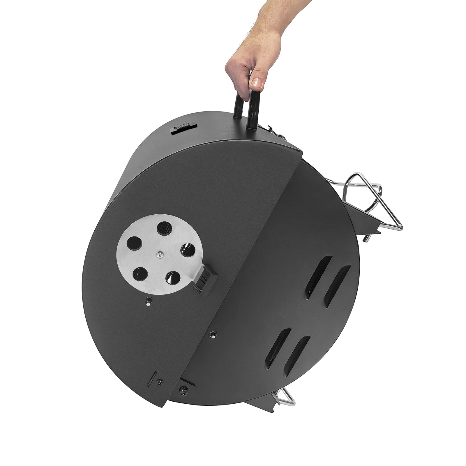 Der geschlossene Tischgrill CHAROX wird am Griff gehalten